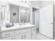 Well-lit bathroom featuring a white vanity, ample counter space, and modern fixtures at 229 St Thomas Dr, Mulberry, FL 33860