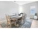 Bright dining area with a wooden table and chairs, complemented by an elegant area rug at 229 St Thomas Dr, Mulberry, FL 33860