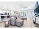 Cozy open-concept living space with a comfortable sectional sofa and seamless transition to the kitchen at 229 St Thomas Dr, Mulberry, FL 33860