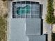 Aerial view of the caged pool area with surrounding yard and patio at 938 Oxford Way, Lake Wales, FL 33853