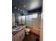Well maintained bathroom with large mirror, bathtub, and shower at 938 Oxford Way, Lake Wales, FL 33853