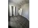 Bedroom with a closet and modern light fixture at 938 Oxford Way, Lake Wales, FL 33853