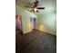 Bedroom featuring tile flooring, a closet, and bright yellow walls at 938 Oxford Way, Lake Wales, FL 33853