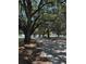Scenic walking path with mature trees and Spanish moss, offering a tranquil outdoor experience at 938 Oxford Way, Lake Wales, FL 33853