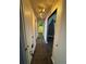 Hallway with neutral paint and tile flooring, with overhead lights at 938 Oxford Way, Lake Wales, FL 33853