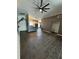 Open floor plan with tile floors, a vaulted ceiling, and easy access to the kitchen at 938 Oxford Way, Lake Wales, FL 33853