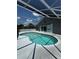A screened-in pool provides hours of summertime fun at 938 Oxford Way, Lake Wales, FL 33853