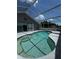 The backyard screened pool offers relaxing vibes at 938 Oxford Way, Lake Wales, FL 33853