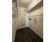 Walk-in closet featuring wire shelving and tile flooring at 938 Oxford Way, Lake Wales, FL 33853