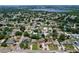 An aerial perspective showcases a quiet neighborhood, featuring well-maintained homes and a serene lake at 212 Overlook Dr, Winter Haven, FL 33884