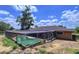 Backyard featuring a screened-in pool area at 212 Overlook Dr, Winter Haven, FL 33884