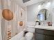 This is a bathroom featuring a sink, toilet and tub with designer shower curtain at 212 Overlook Dr, Winter Haven, FL 33884