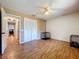 Bedroom with ceiling fan, and spacious closet with hardwood floors throughout at 212 Overlook Dr, Winter Haven, FL 33884