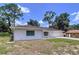 Charming one-story home featuring a brick exterior, well-maintained landscaping and a one car garage at 212 Overlook Dr, Winter Haven, FL 33884