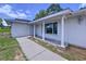 Charming covered porch with pillars, leading to the front entrance of this inviting home at 212 Overlook Dr, Winter Haven, FL 33884