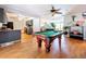Game room featuring hardwood floors, light gray walls with white trim and view to dining room at 212 Overlook Dr, Winter Haven, FL 33884