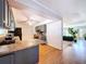 Open concept kitchen with stainless steel appliances and breakfast bar transitions into a living area at 212 Overlook Dr, Winter Haven, FL 33884