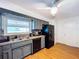 Well-lit kitchen features stainless steel appliances, a window over the sink, and wooden floors at 212 Overlook Dr, Winter Haven, FL 33884