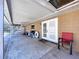 Covered outdoor patio with concrete flooring, ceiling fan, and access to the home's interior at 212 Overlook Dr, Winter Haven, FL 33884