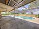 Screened-in pool area with concrete deck and a clear view of the pool at 212 Overlook Dr, Winter Haven, FL 33884