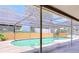 Screened-in pool with concrete deck and low brick privacy wall at 212 Overlook Dr, Winter Haven, FL 33884