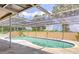 Screened-in pool with surrounding concrete deck and clear blue sky above at 212 Overlook Dr, Winter Haven, FL 33884