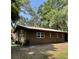 This brick home has many windows and a dark roof at 2748 Cr 543, Sumterville, FL 33585