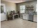 Updated kitchen featuring tiled flooring, stainless steel appliances, and an adjacent dining area at 2748 Cr 543, Sumterville, FL 33585