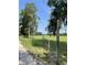 Grassy land with rustic wooden fence, trees and open space at 2748 Cr 543, Sumterville, FL 33585
