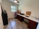 This office is equipped with a long desk, drawers, a chair, and natural light at 2748 Cr 543, Sumterville, FL 33585