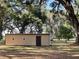 The storage building features metal siding and a metal roof at 2748 Cr 543, Sumterville, FL 33585