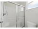 Bathroom showcasing the shower with glass enclosure and modern fixtures at 413 Bay Leaf Dr, Poinciana, FL 34759