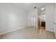 Bedroom features neutral walls, tile flooring, and a closet with mirrored doors at 413 Bay Leaf Dr, Poinciana, FL 34759