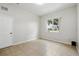Neutral bedroom with tile floors and a bright window with neighborhood views at 413 Bay Leaf Dr, Poinciana, FL 34759