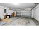 An empty two car garage in need of cleaning at 413 Bay Leaf Dr, Poinciana, FL 34759