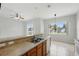 Bright, open kitchen featuring a breakfast bar and plenty of counter space at 413 Bay Leaf Dr, Poinciana, FL 34759