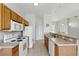 Well-equipped kitchen featuring tile floors, modern appliances, and an open layout for easy access to adjacent spaces at 413 Bay Leaf Dr, Poinciana, FL 34759