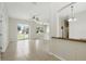 Bright and airy living room featuring neutral paint, a ceiling fan, and sliding glass doors that let in natural light at 413 Bay Leaf Dr, Poinciana, FL 34759