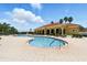 Inviting community pool with adjacent clubhouse featuring a red tile roof and arched entryway at 413 Bay Leaf Dr, Poinciana, FL 34759