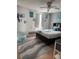 Bright bedroom featuring hard wood floors, plenty of decorations and furniture, and cool toned bedding at 609 Linnet Ct, Poinciana, FL 34759