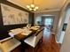 Elegant dining room features tile floors, stylish decor, and flows into the living space at 609 Linnet Ct, Poinciana, FL 34759
