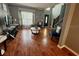 Well-lit living room with tile flooring, a staircase and comfortable seating at 609 Linnet Ct, Poinciana, FL 34759