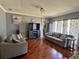 Comfortable living room featuring neutral decor and tile floors at 609 Linnet Ct, Poinciana, FL 34759
