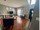 Cozy living room featuring tile floors, neutral walls, and comfortable seating arrangement at 609 Linnet Ct, Poinciana, FL 34759