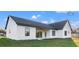 The backyard features a covered patio and a well-maintained lawn at 112 Cr 532B, Bushnell, FL 33513