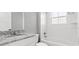 Bright bathroom with a tub and shower combination and granite countertops at 112 Cr 532B, Bushnell, FL 33513