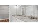 Bright bathroom features dual sinks, granite countertops, and ample storage with a view into the walk-in closet at 112 Cr 532B, Bushnell, FL 33513