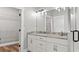 Bathroom featuring a granite countertop, double sinks, and a view of the closet at 112 Cr 532B, Bushnell, FL 33513
