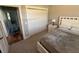 Cozy bedroom featuring a bed, nightstand, and closet at 112 Cr 532B, Bushnell, FL 33513