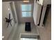 Well-lit bedroom with ceiling fan and large windows with louvre blinds at 112 Cr 532B, Bushnell, FL 33513